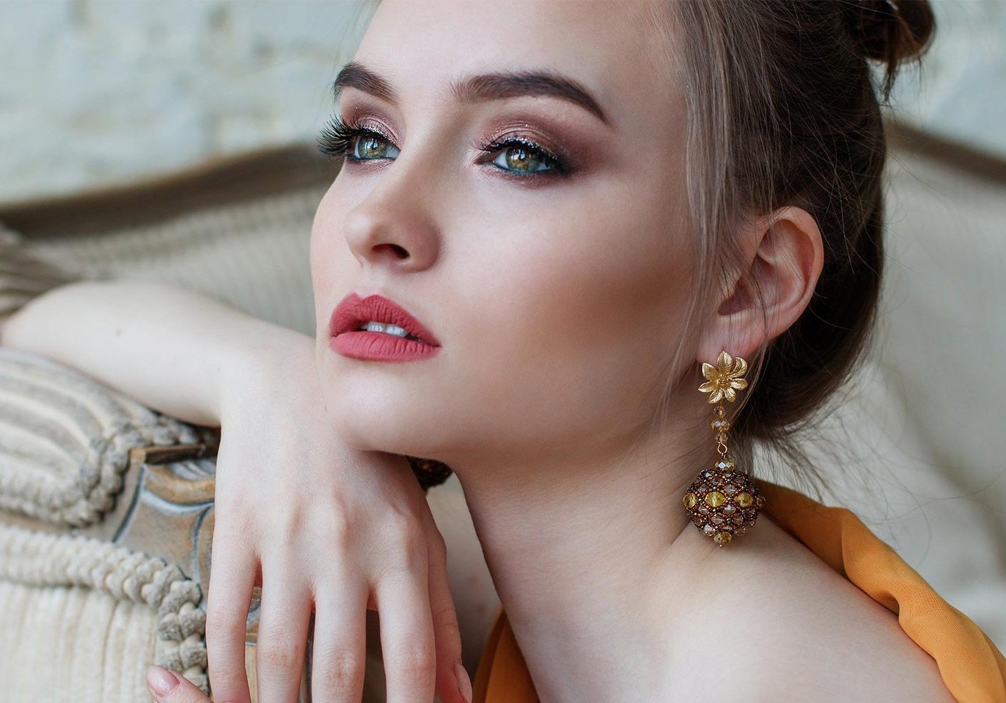 Woman wearing makeup in profile